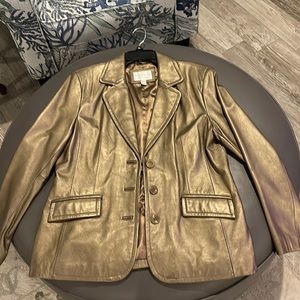 Gold leather jacket, new condition, lightly worn. Very clean lining.